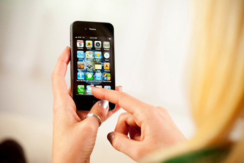 Woman using cooking apps on her iphone