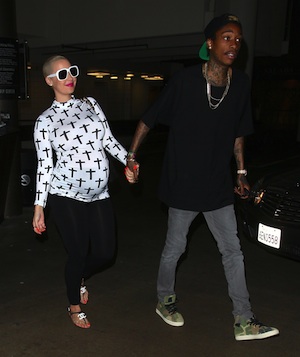 Amber Rose pregnant walks with Wiz Khalifa.