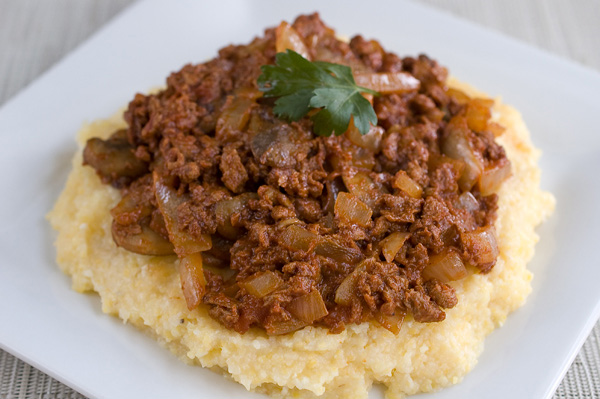 Chorizo ragu over creamy polenta