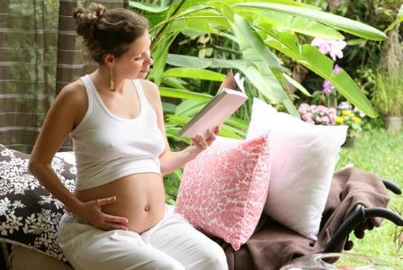 Pregnant woman reading a book