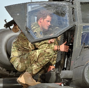 Prince Harry loading into an Apache