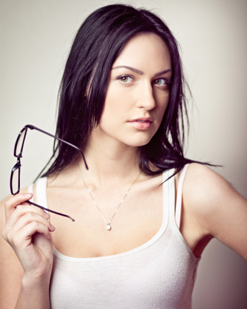 Woman holding eyeglasses