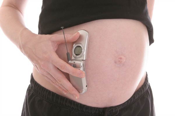 Pregnant woman with cell phone