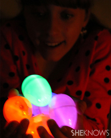 Girl holding glow in the dark eggs