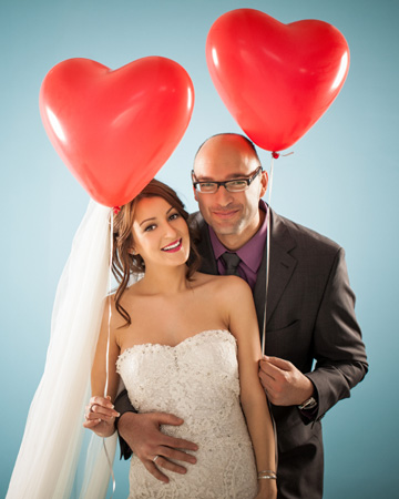 Bride and groom with heart balloons