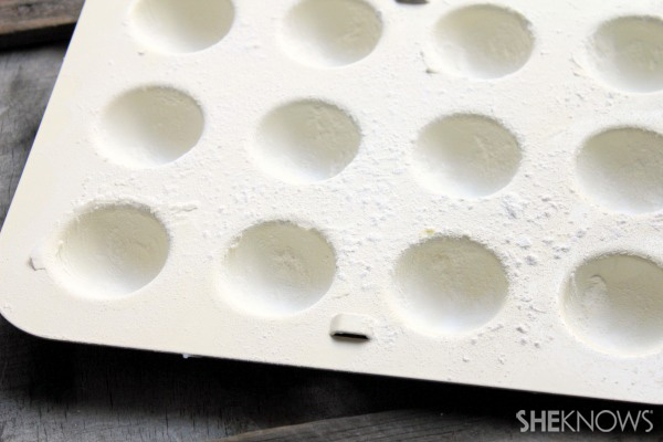 Sprinkle flour on molds