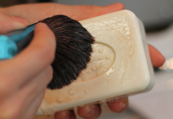 Cleaning makeup brush with soap