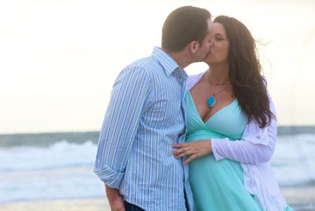 Couple on babymoon at beach