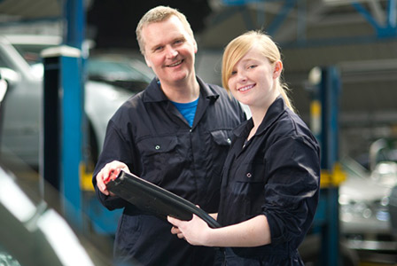 dad and daughter in car shop