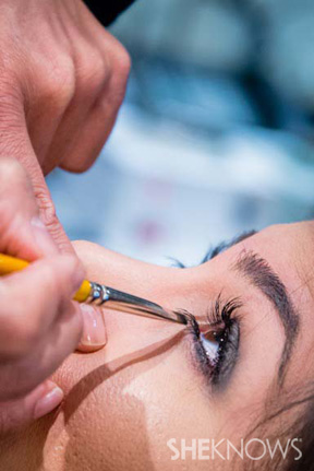 Makeup artist using makeup brush