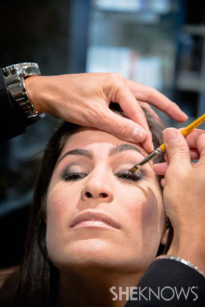 Makeup artist using makeup brush