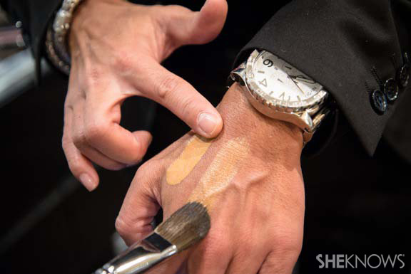 Makeup artist using makeup brush