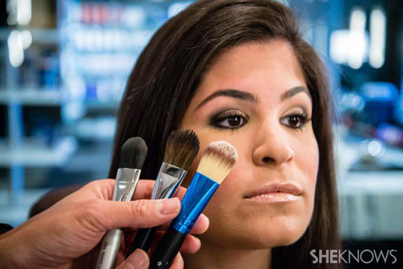Makeup artist using makeup brush