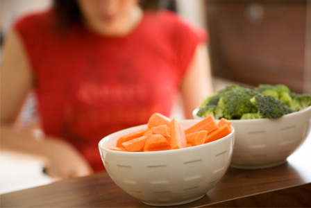Woman cutting vegetables