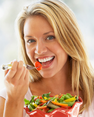 Woman eating healthy salad