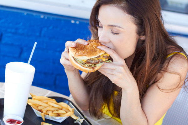 Woman eating junk food