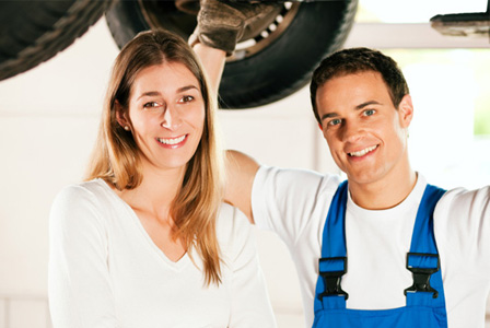 Woman having tires fixed