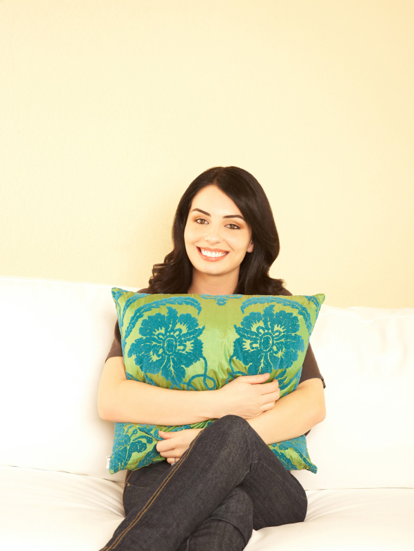 Woman holding throw pillow
