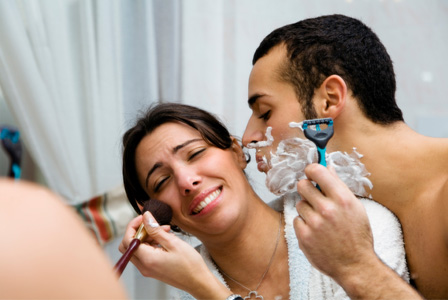 Woman sharing bathroom with man