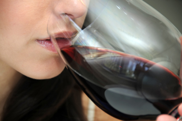 Woman smelling wine
