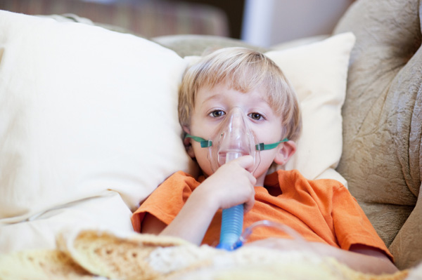 Young boy having breathing treatment