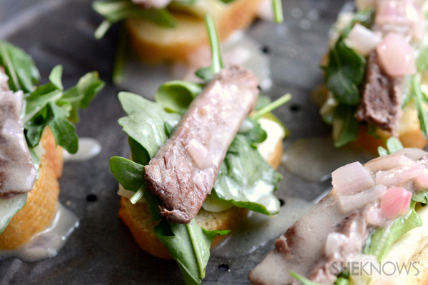 Steak crostinis with champagne butter sauce