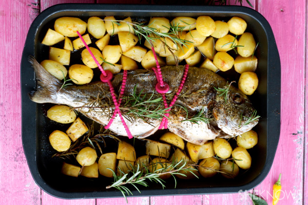 baked whole fish and potatoes