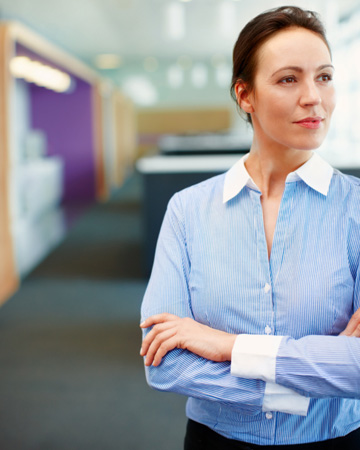 Woman in office thinkng