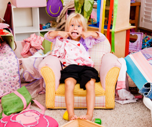 Kid in messy bedroom