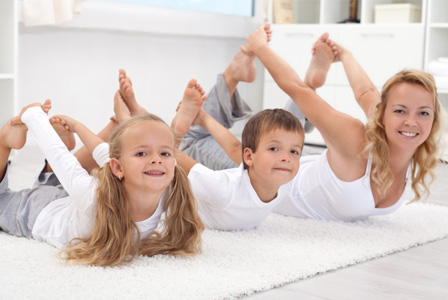 Mom doing yoga with kids