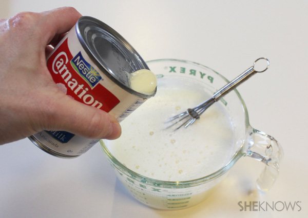 Adding sweetened condensed milk to the gelatin-margarita mixture