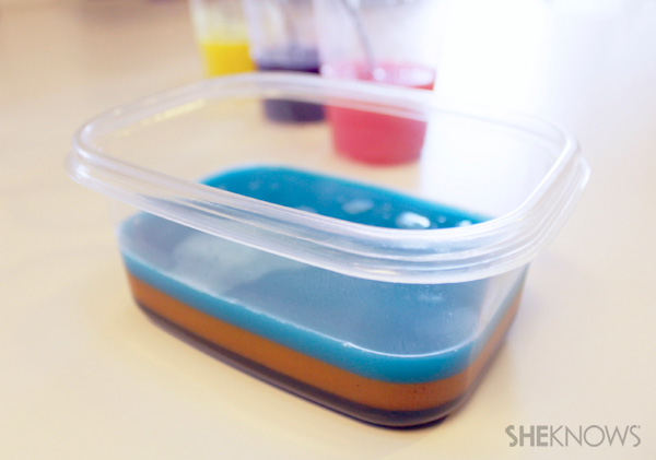 Colored gelatin mixture layered in a plastic container