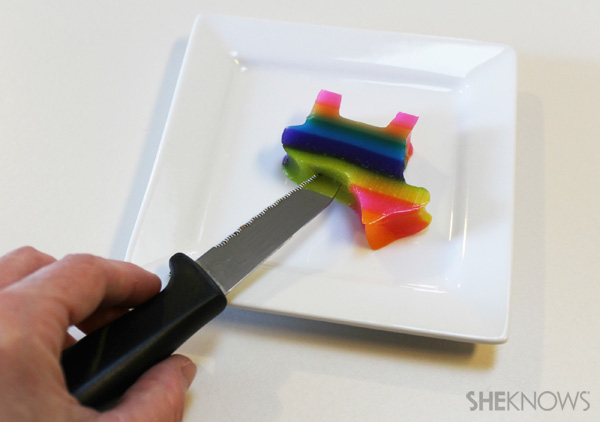 Cutting a slit into the pinata-shaped jello shot