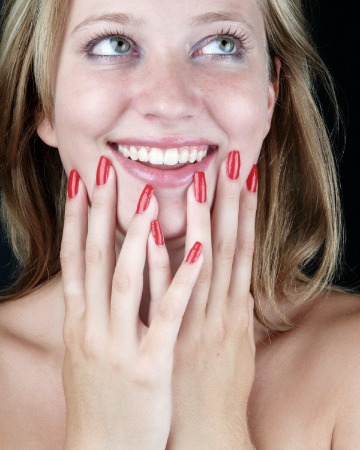 Blonde with red manicure