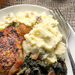 crispy chicken thighs with braised kale and mashed potatoes