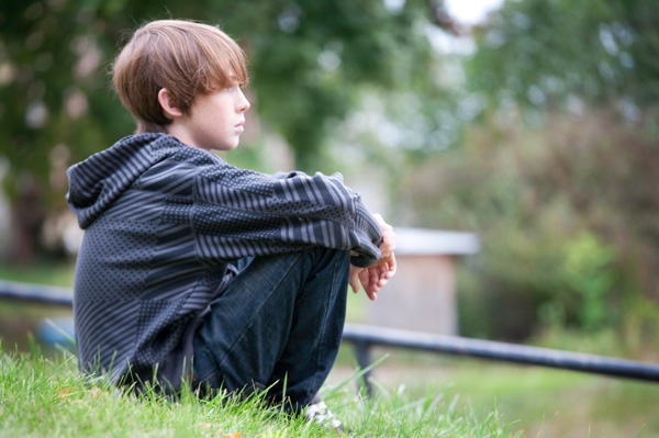 Boy sitting and thinking