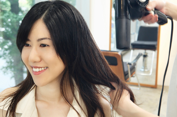 Woman getting cashmere blowout