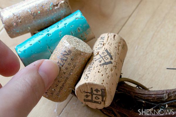 Step 2: Glue corks onto the wreath randomly