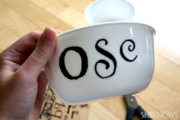 Apply letter stickers to bowl