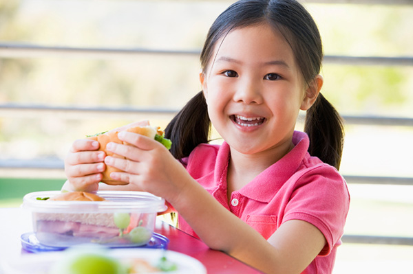 Young girl eating lunch