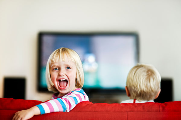 Brother and sister watching tv