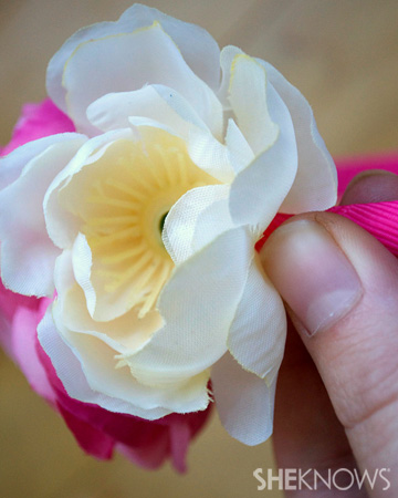Hold flower down on headband