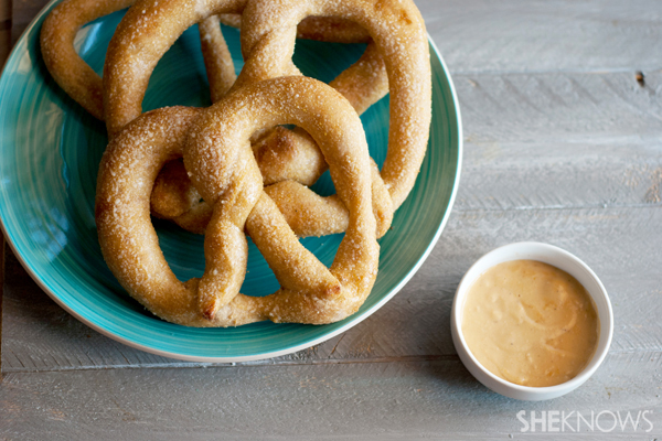 Warm cheesy beer dip with soft pretzels