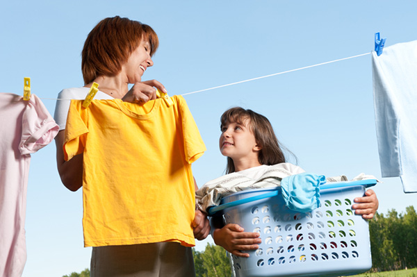Mother and daughter doing laundry