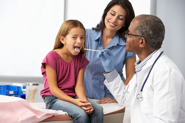 Young girl getting a wellness exam