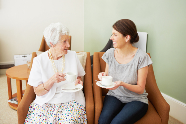 Adult granddaughter visiting with grandmother