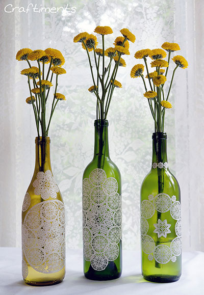 Doily decoupaged wine bottles