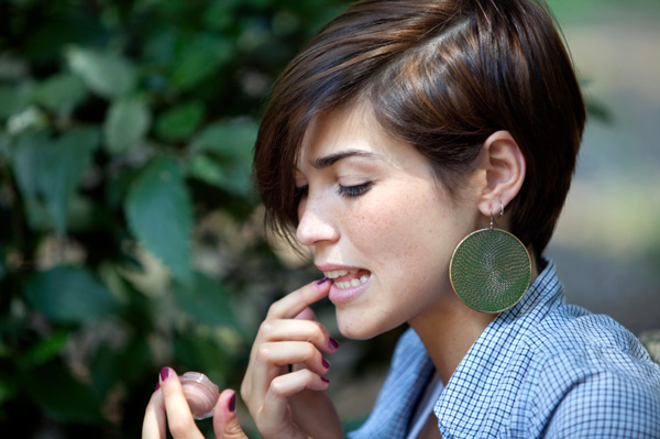 Woman applying lip balm