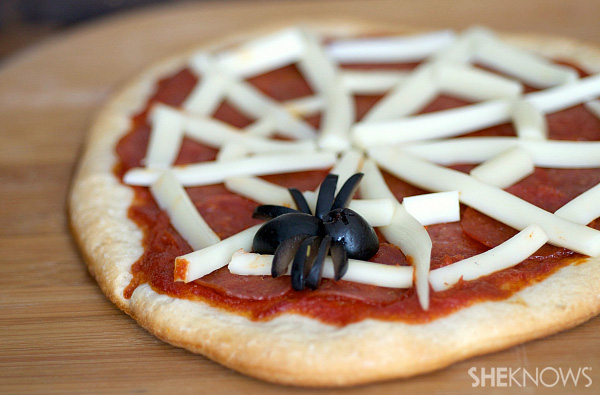Homemade spider web pizza