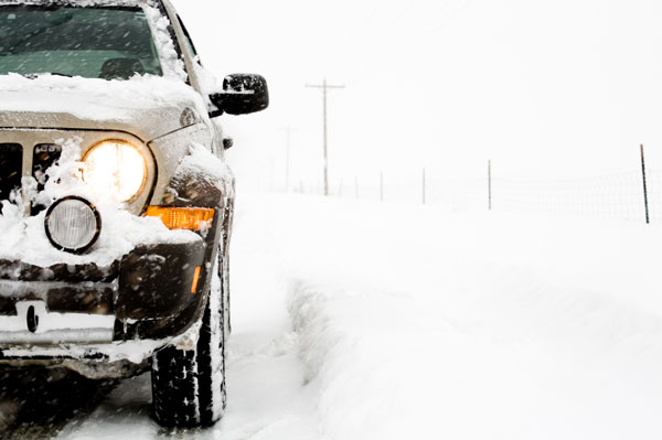 Vehicle sitting in snowy weather